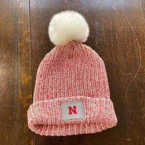 Love Your Melon red speckled cotton cap w white detachable pom pom, Cornhuskers